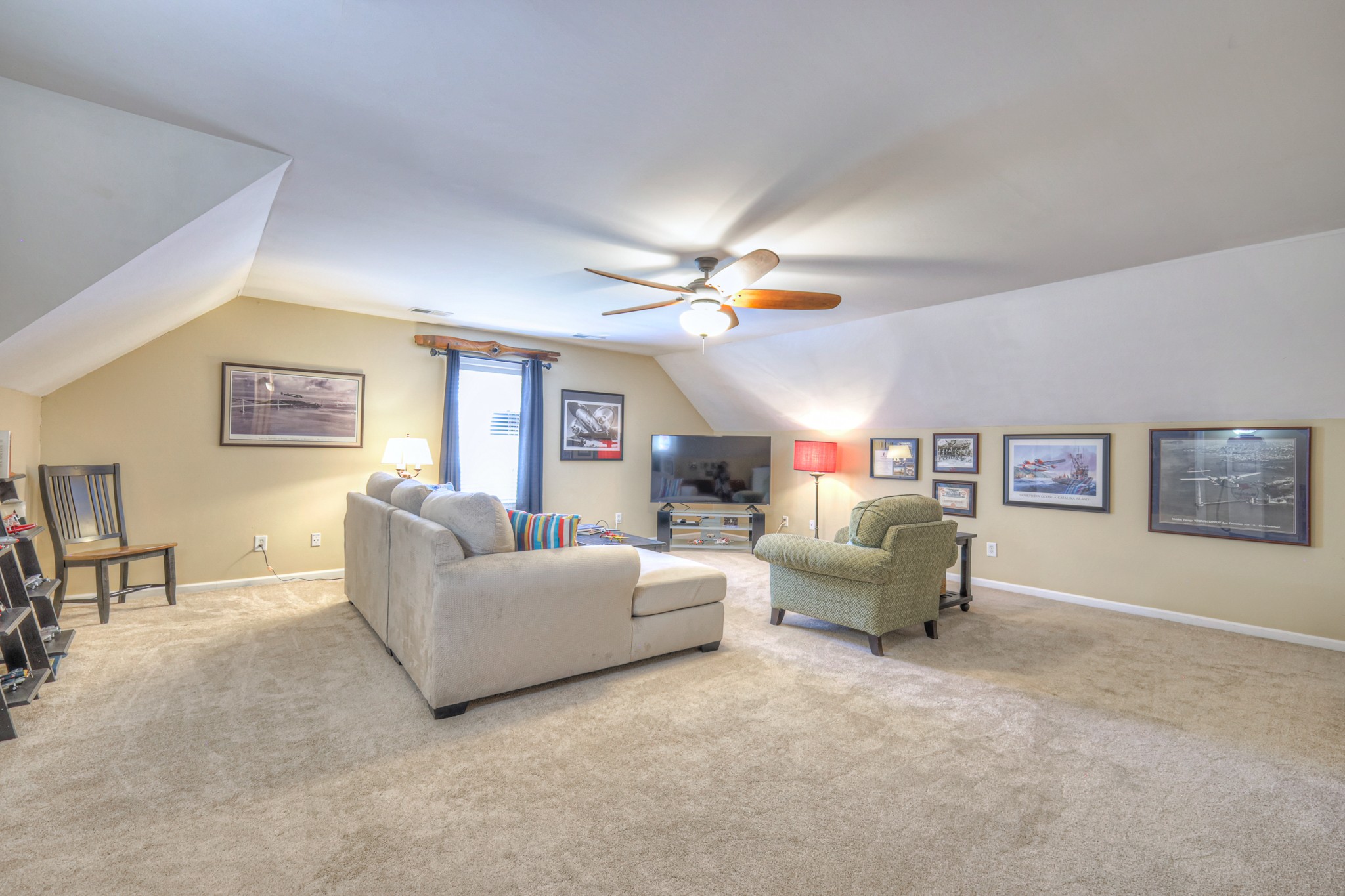 431 Conquest Road Murfreesboro, TN 37128 - Photo 34 of 55 a living room with furniture and a chandelier