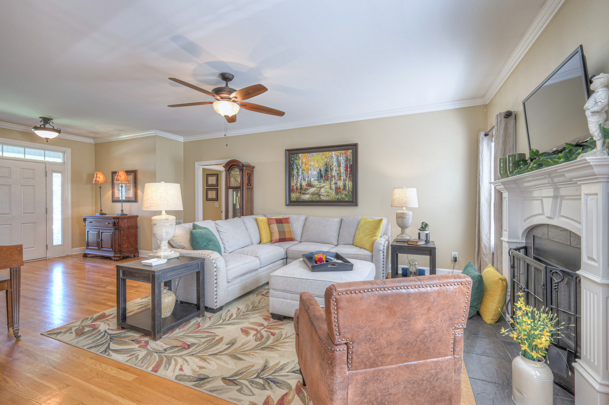 431 Conquest Road Murfreesboro, TN 37128 - Photo 10 of 55 a living room with furniture a fireplace and a flat screen tv
