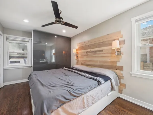 a bedroom with a bed and window