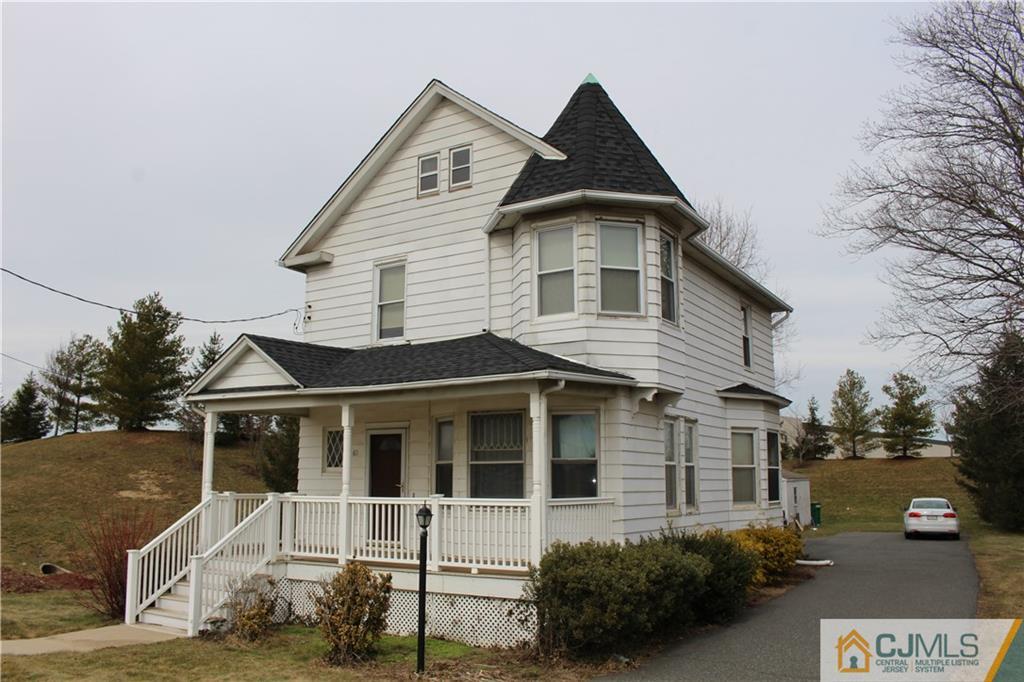 65 Station Road Cranbury, NJ 08512 - Photo 3 of 11 a front view of a house with a yard