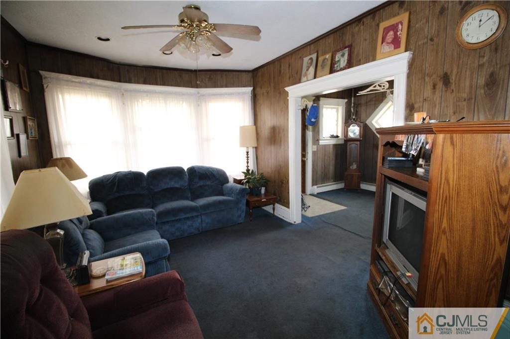 65 Station Road Cranbury, NJ 08512 - Photo 5 of 11 a living room with furniture and a window