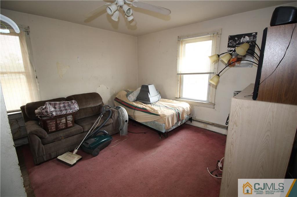 65 Station Road Cranbury, NJ 08512 - Photo 8 of 11 a living room with furniture and a window