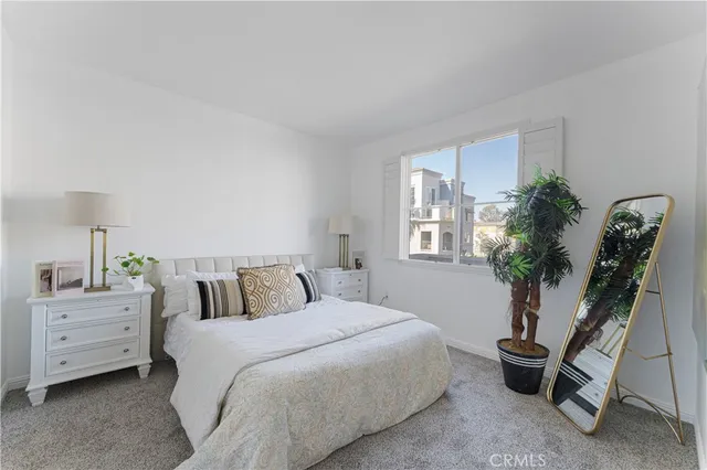 a view of a kitchen with wooden floor and a refrigerator