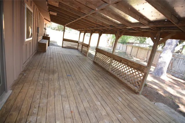 a view of outdoor space with wooden floor