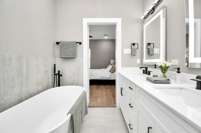 a white bath tub sitting in a bathroom