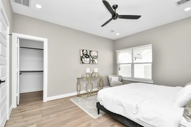 a bedroom with a bed and window