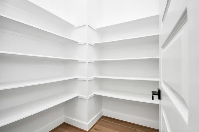 a bedroom with a bed and a table