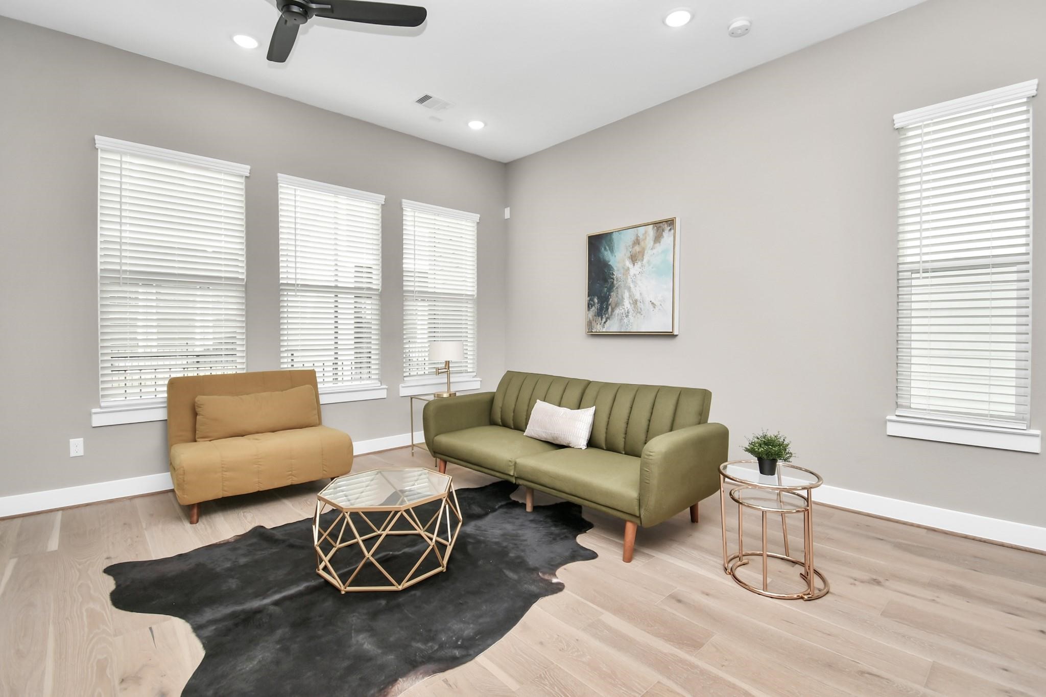 316 Thornton Road, Unit E Houston, TX 77018 - Photo 6 of 27 a living room with furniture and a large window