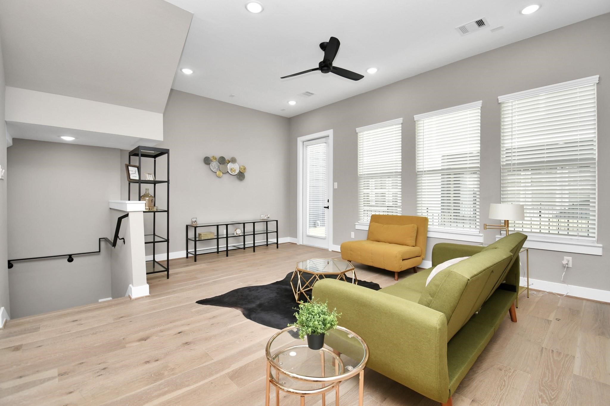 316 Thornton Road, Unit E Houston, TX 77018 - Photo 7 of 27 a living room with furniture and a large window