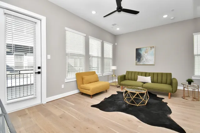 a living room with furniture and a large window
