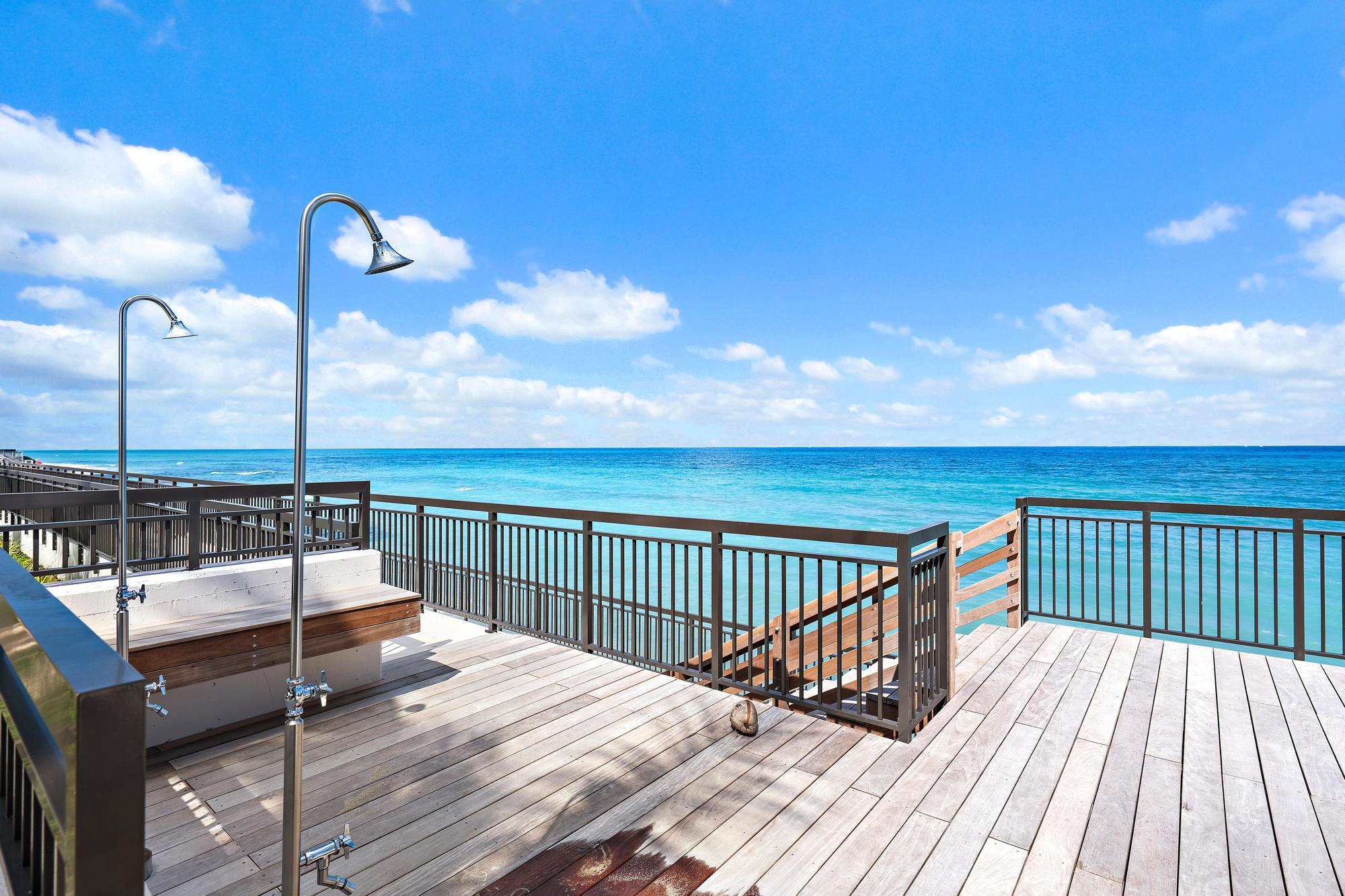 5380 North Ocean Drive, Unit 10J Singer Island, FL 33404 - Photo 21 of 37 a view of roof deck with two chairs and wooden floor