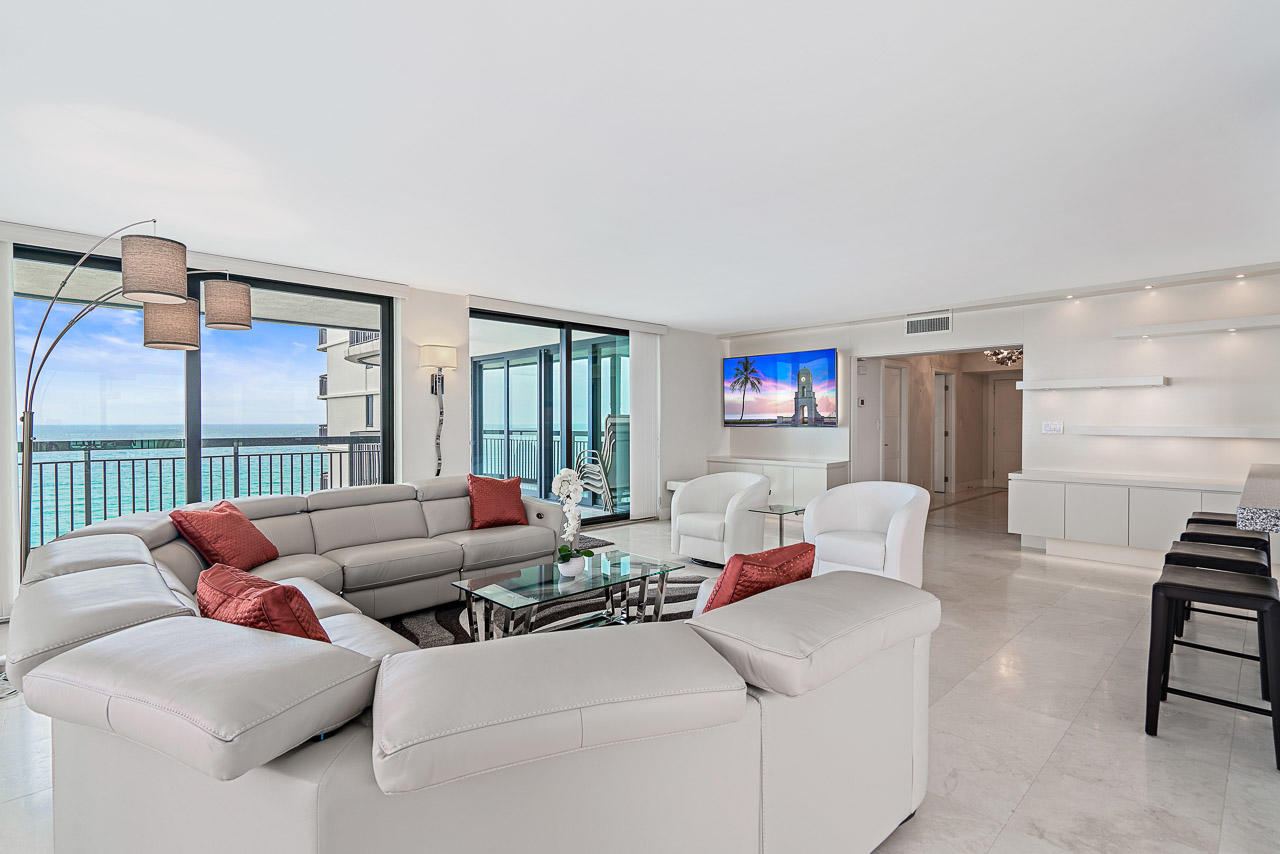 5380 North Ocean Drive, Unit 10J Singer Island, FL 33404 - Photo 3 of 37 a living room with furniture and a table