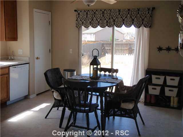 7760 Coffee Road Peyton, CO 80831 - Photo 6 of 16 Eat-in country kitchen