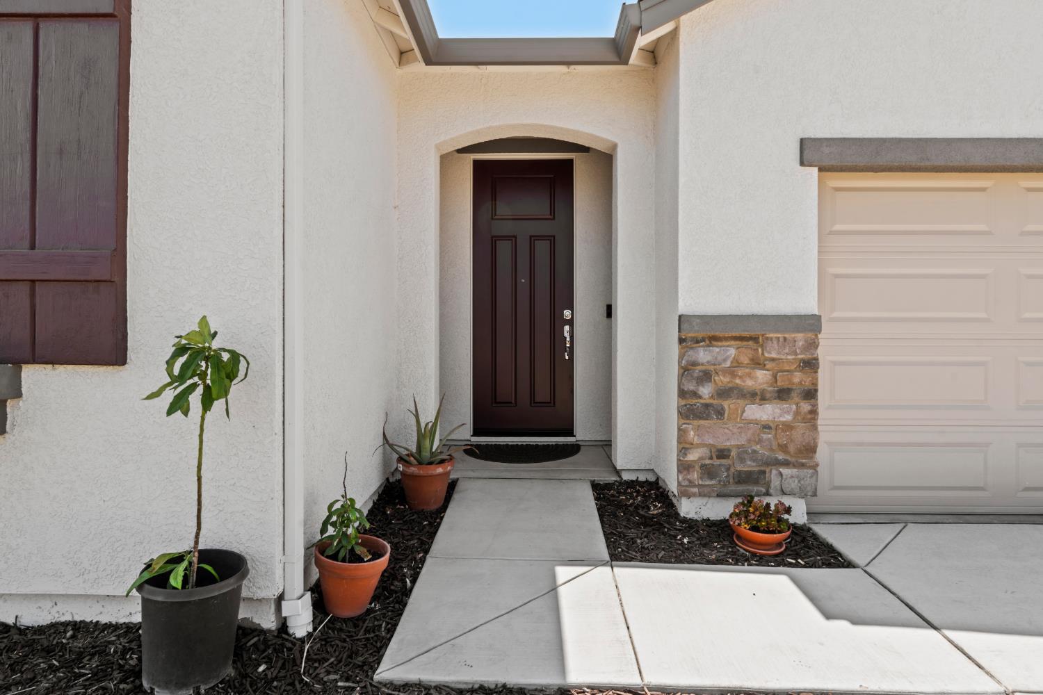 5713 Natalie Way Keyes, CA 95328 - Photo 18 of 30 a front view of a house with seating space