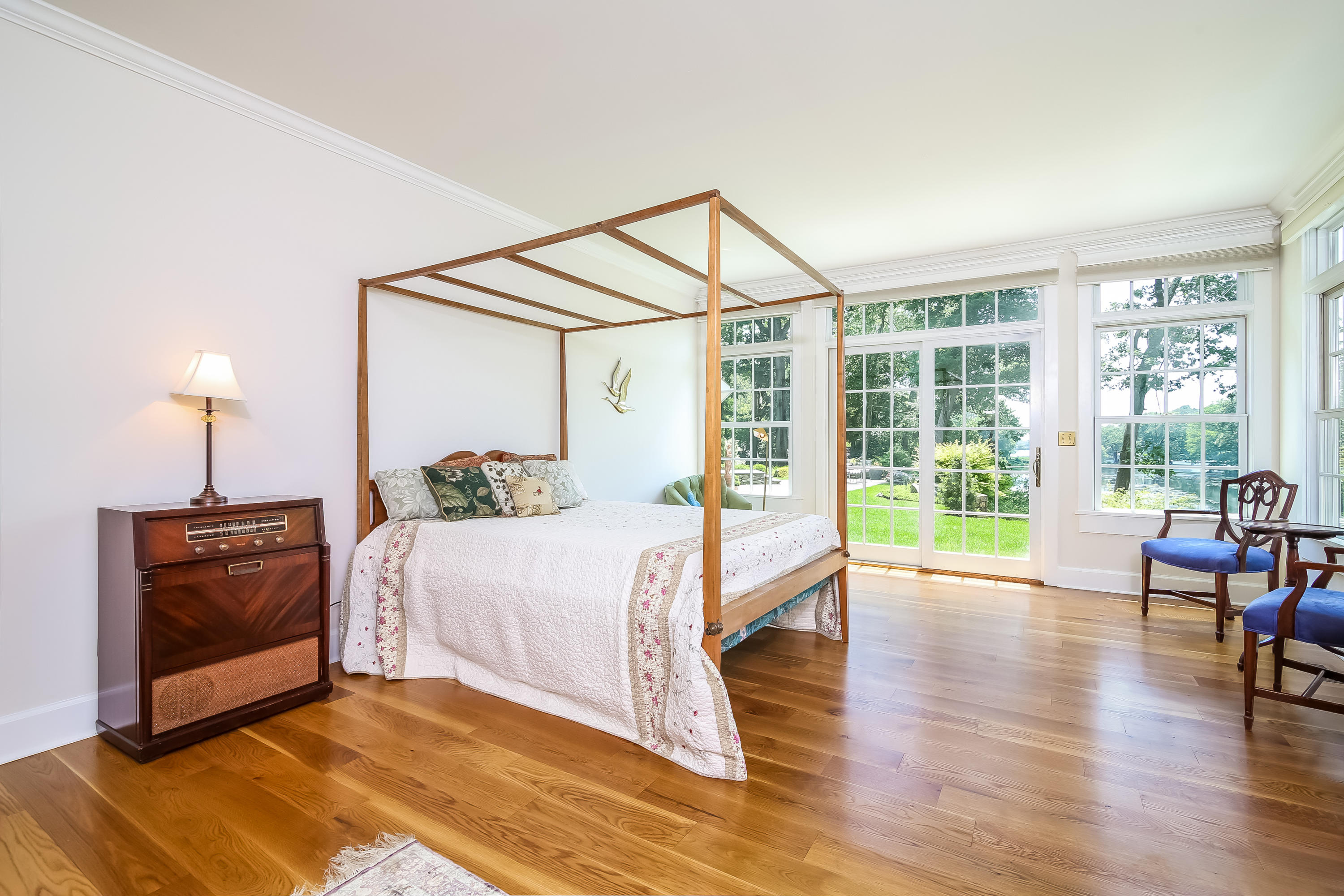 65 Goodwives River Road Darien, CT 06820 - Photo 16 of 36 a bed room with a bed and a chair