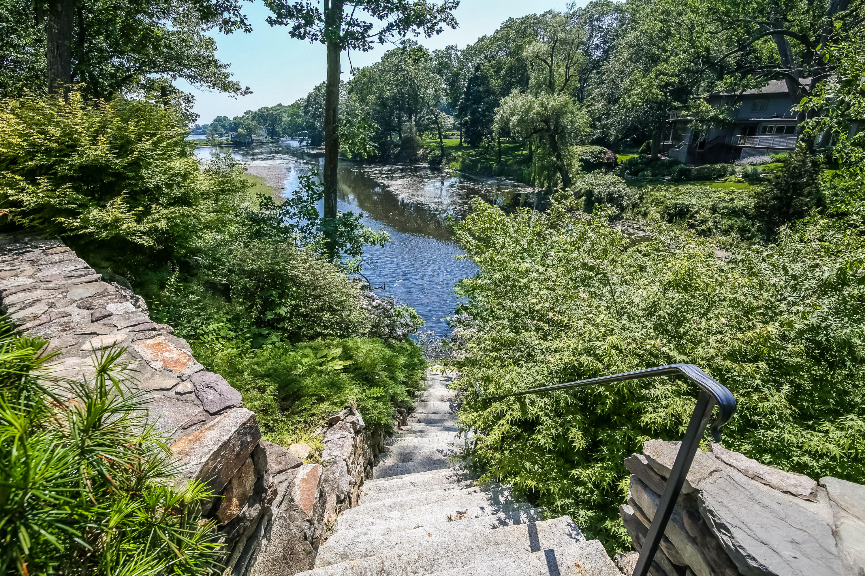 65 Goodwives River Road Darien, CT 06820 - Photo 33 of 36 a view of a lake with a house