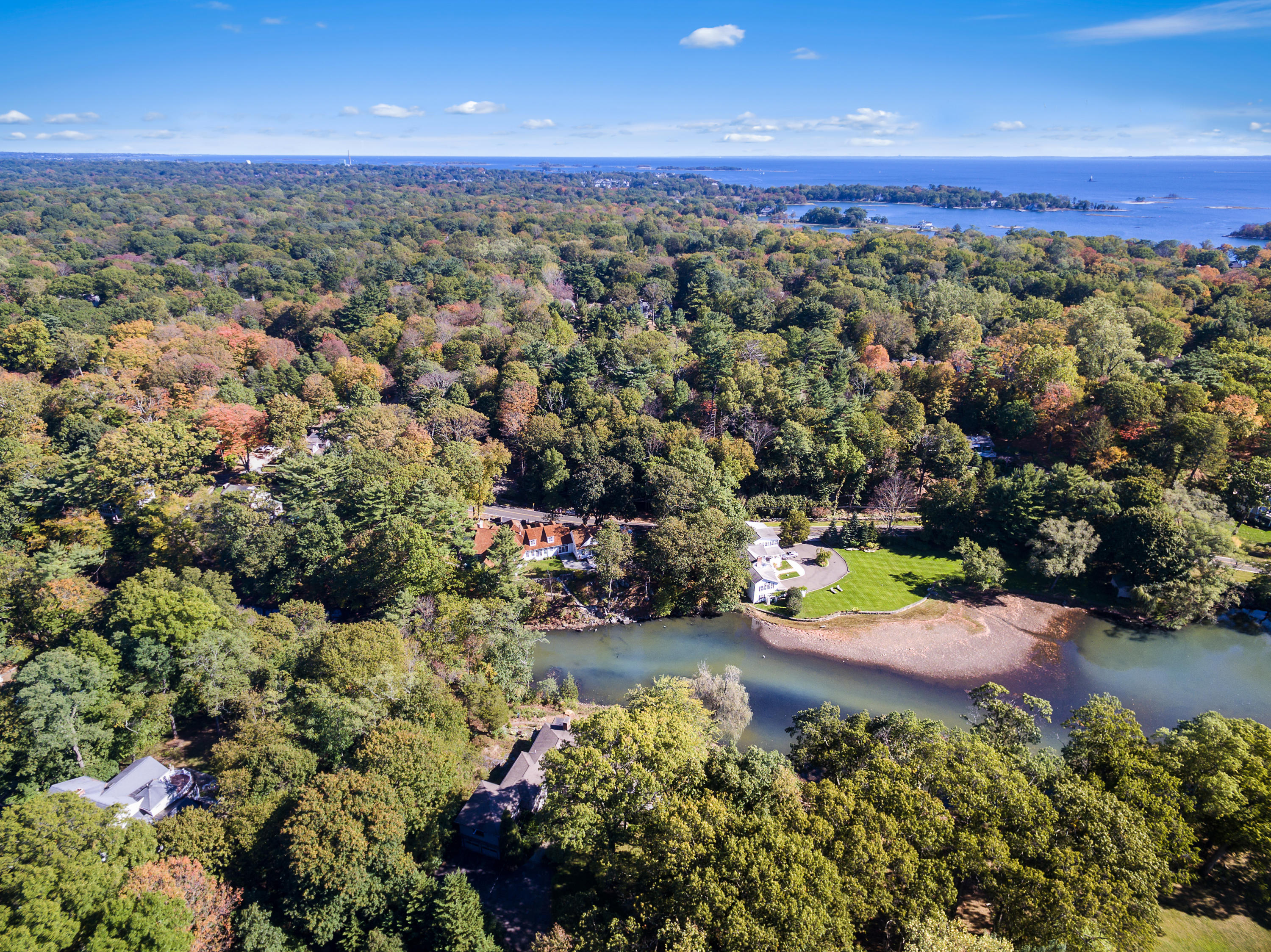 65 Goodwives River Road Darien, CT 06820 - Photo 34 of 36 an aerial view of a houses with a yard
