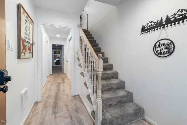 a view of entryway with wooden floor