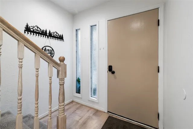 a view of a hallway with staircase