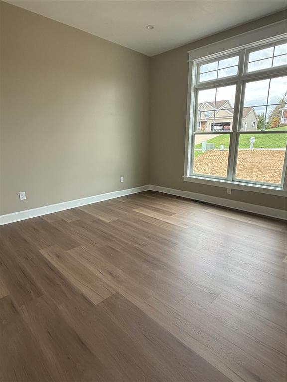 136 Huckleberry Road Indiana, PA 15701 - Photo 12 of 20 an empty room with wooden floor and windows