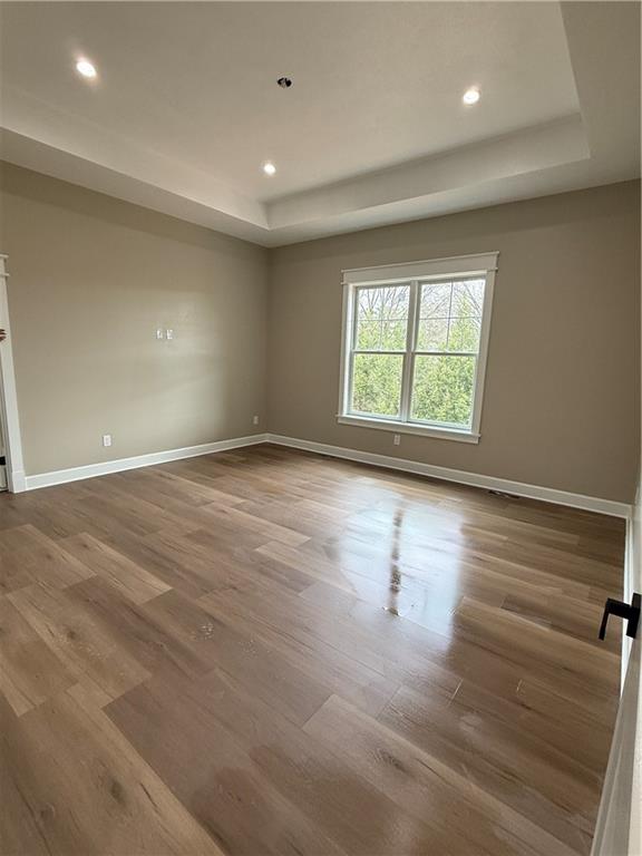 136 Huckleberry Road Indiana, PA 15701 - Photo 13 of 20 an empty room with wooden floor and windows