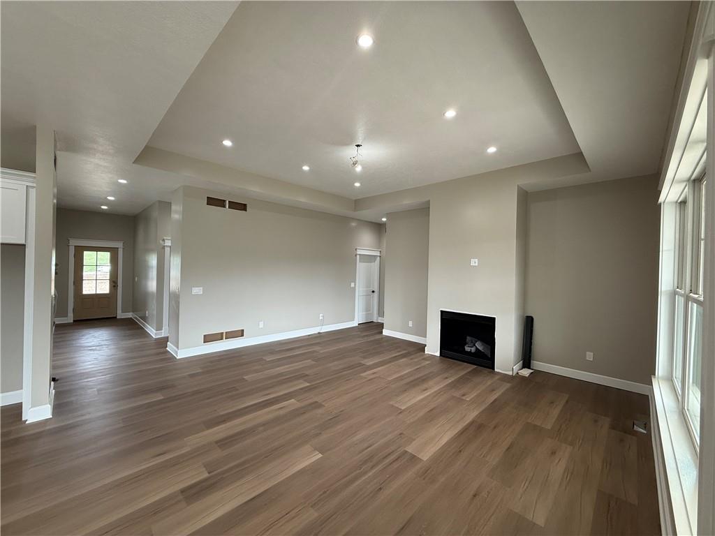 136 Huckleberry Road Indiana, PA 15701 - Photo 5 of 20 an empty room with wooden floor and fireplace