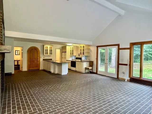 a kitchen with stainless steel appliances granite countertop a sink and stove