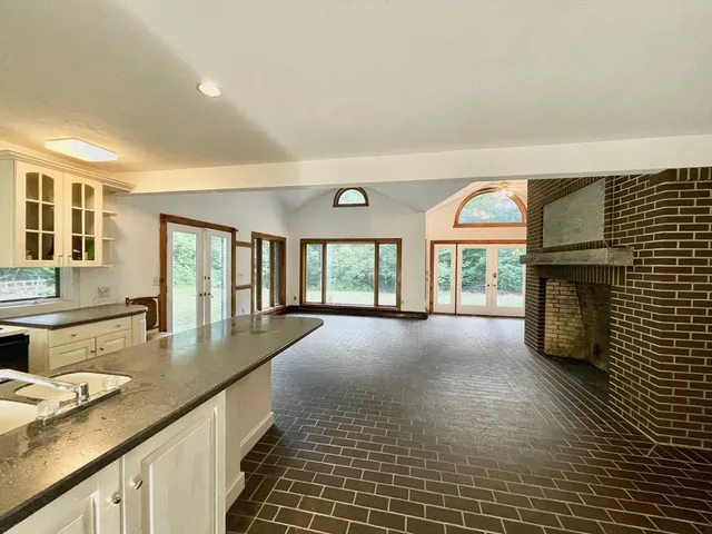 a kitchen with counter top space and cabinets
