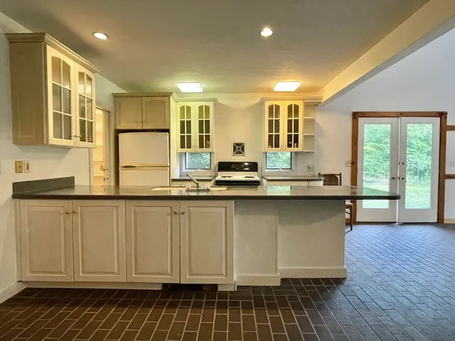 a kitchen with a stove and a sink