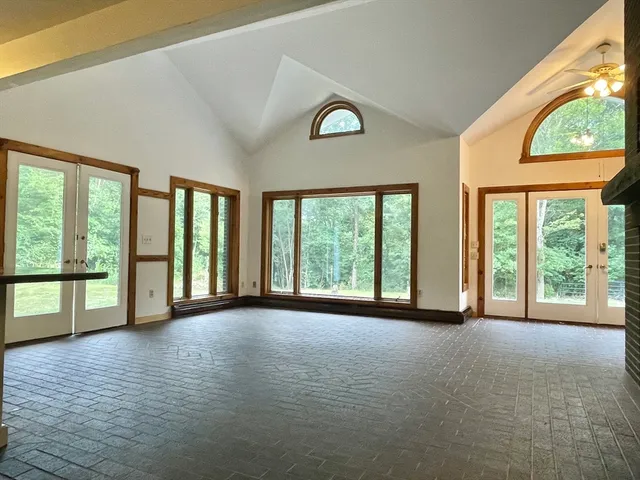 a view of an empty room with a large window