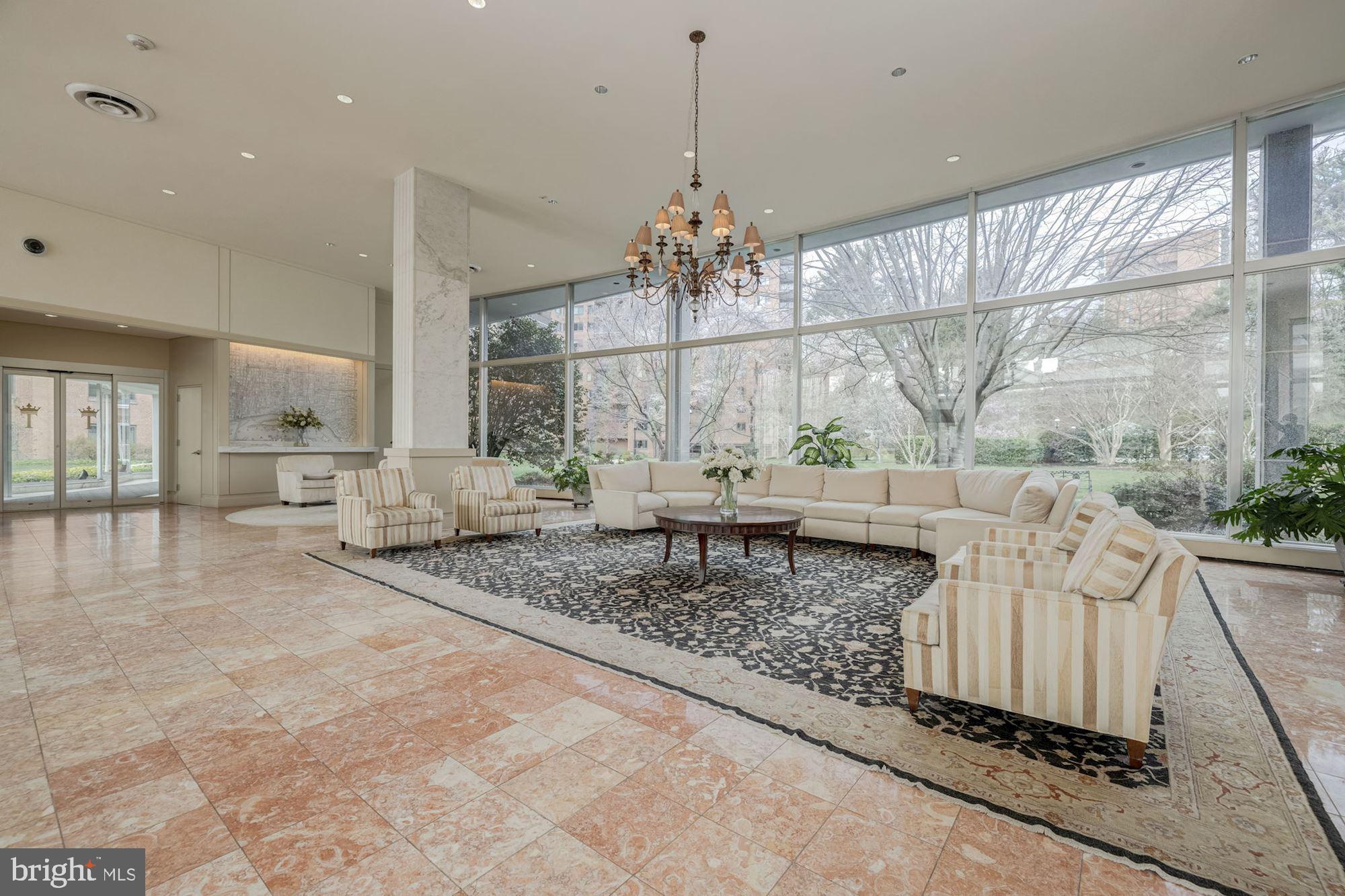 4201 Cathedral Avenue Northwest, Unit 620E Washington, DC 20016 - Photo 3 of 28 a living room with furniture and a large window