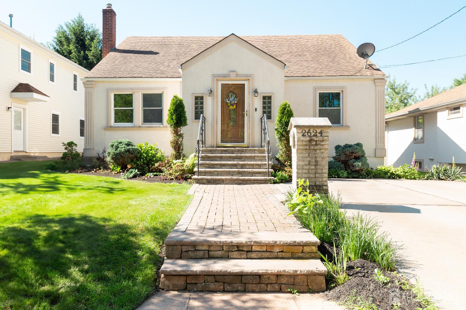 2624 Tremley Point Road Linden, NJ 07036 - Photo 1 of 43 a front view of a house with garden