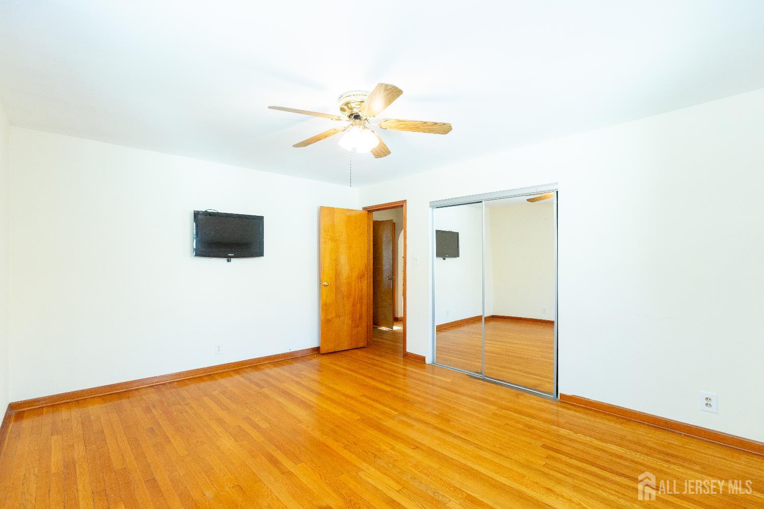 2624 Tremley Point Road Linden, NJ 07036 - Photo 15 of 43 a view of empty room with wooden floor
