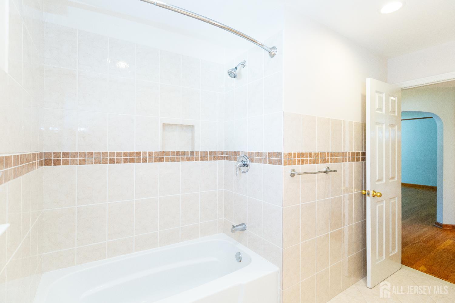 2624 Tremley Point Road Linden, NJ 07036 - Photo 23 of 43 a bathroom with a bathtub and a shower