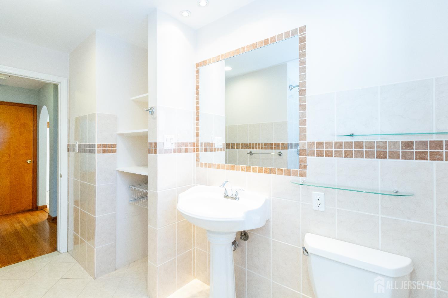 2624 Tremley Point Road Linden, NJ 07036 - Photo 24 of 43 a bathroom with a sink a toilet and shower