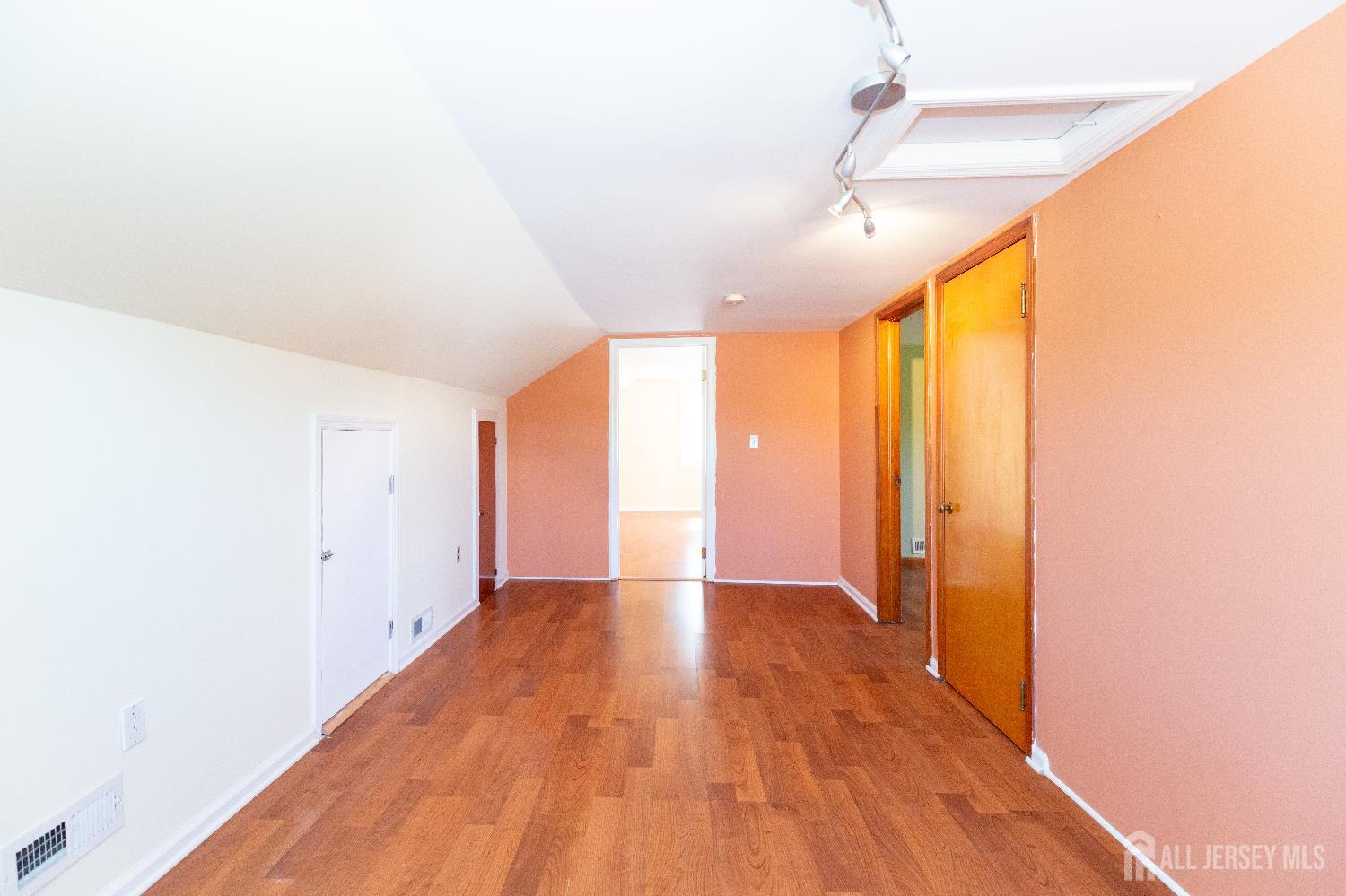2624 Tremley Point Road Linden, NJ 07036 - Photo 30 of 43 a view of an empty room with wooden floor