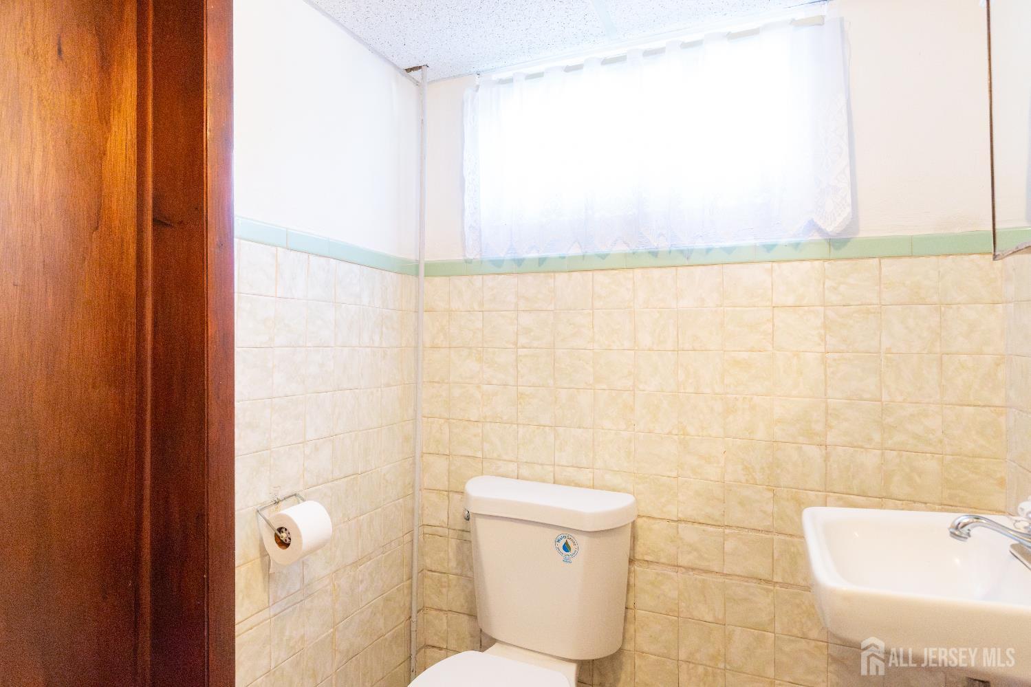 2624 Tremley Point Road Linden, NJ 07036 - Photo 38 of 43 a bathroom with a toilet and a shower