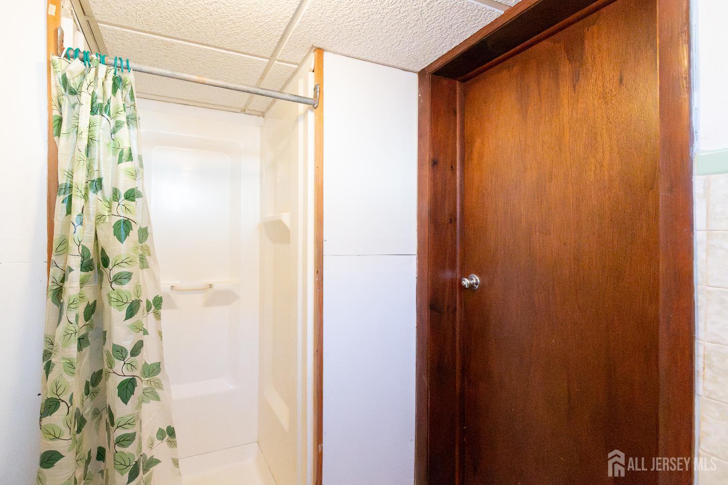 2624 Tremley Point Road Linden, NJ 07036 - Photo 39 of 43 a bathroom with a shower and a shower curtain
