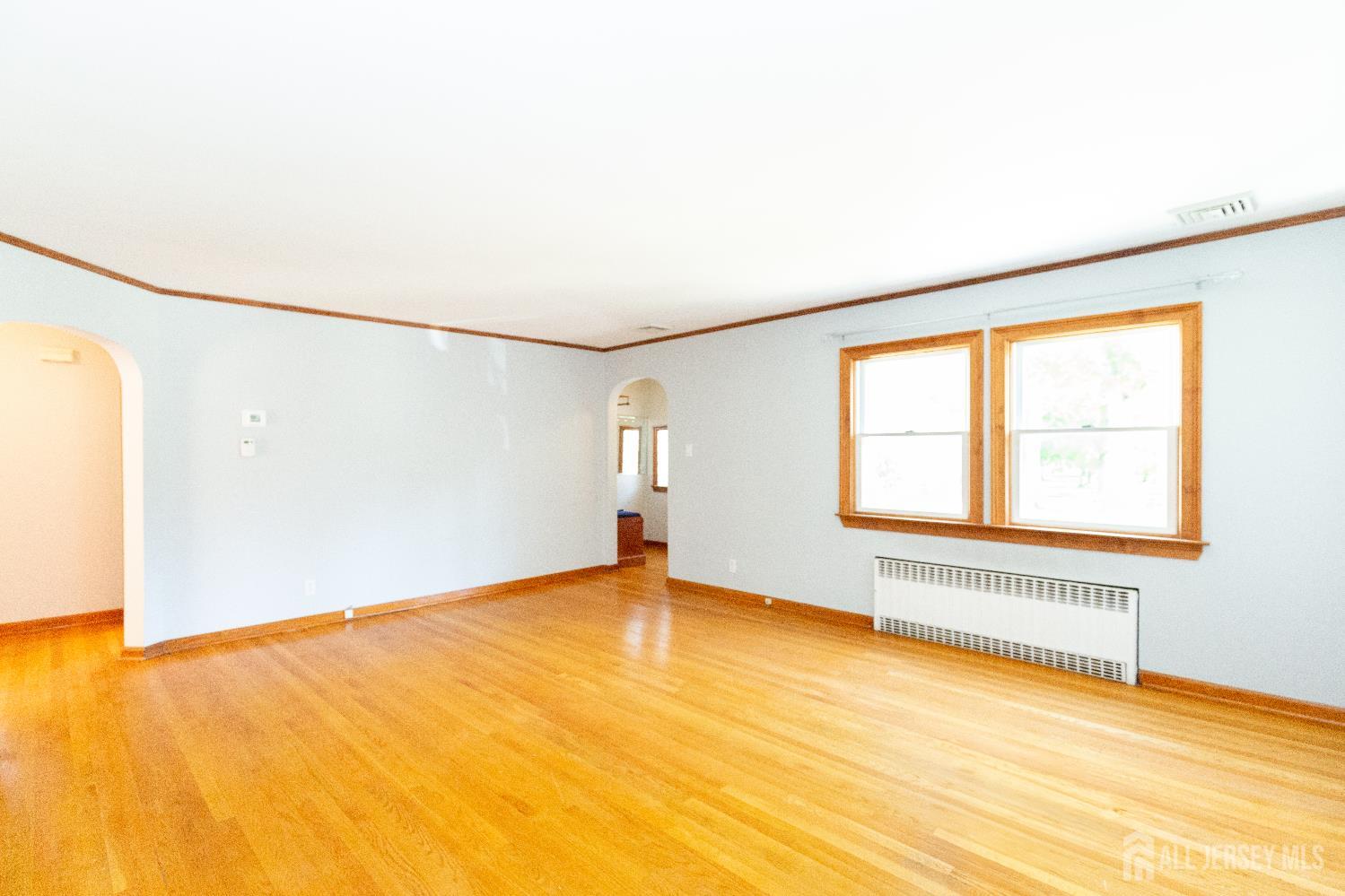 2624 Tremley Point Road Linden, NJ 07036 - Photo 7 of 43 an empty room with a empty space and windows