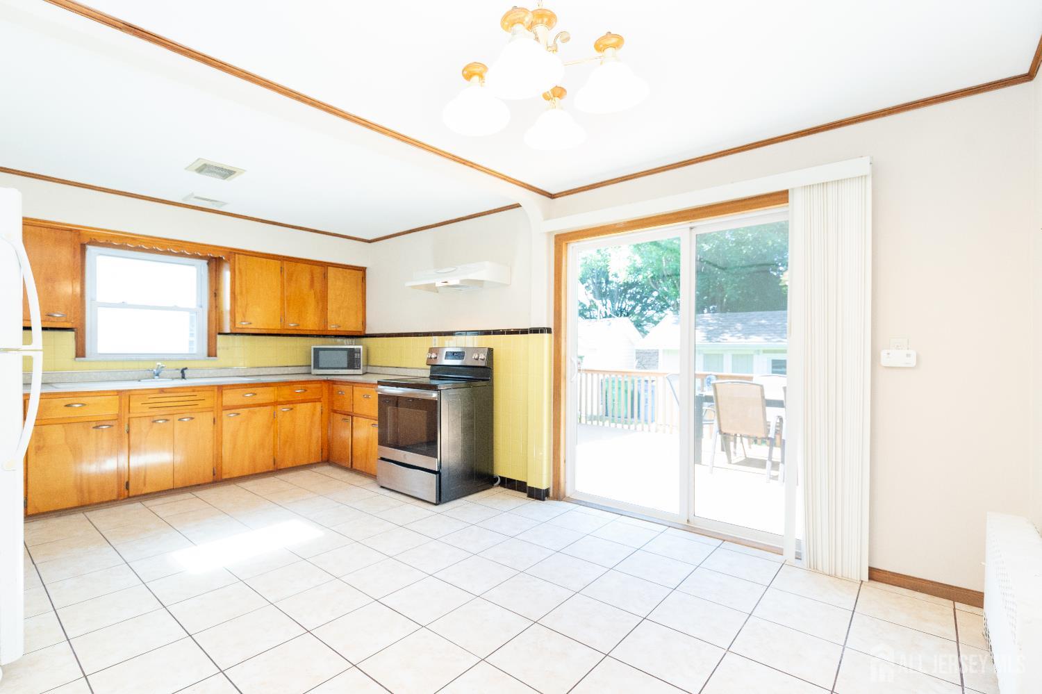 2624 Tremley Point Road Linden, NJ 07036 - Photo 9 of 43 a large kitchen with a window