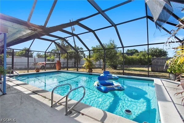 a view of a swimming pool with a patio