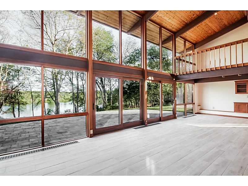 100 Mill Pond Road Exeter, RI 02822 - Photo 13 of 25 Den/Family/Great Room. Amazing blend of indoor and outdoor living.