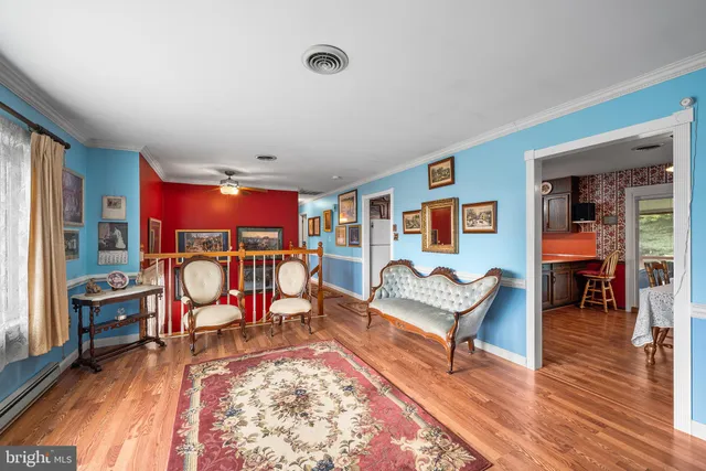 a living room with furniture rug and window