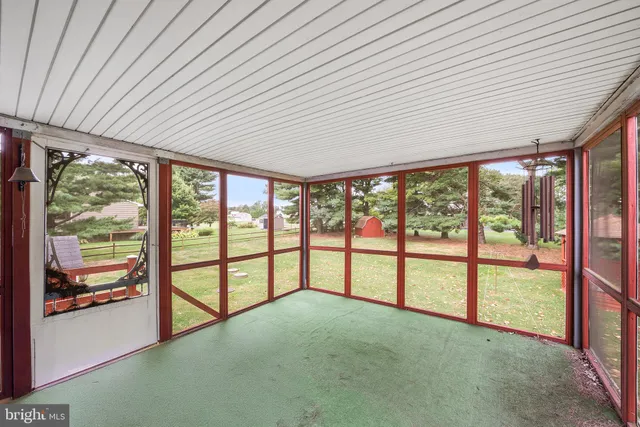 a view of outdoor space with deck and trees