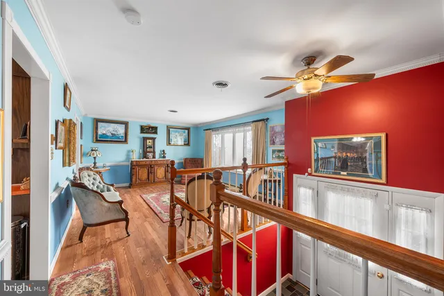 a living room with furniture rug and window