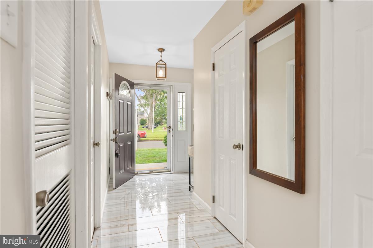 602 Platte Road Fairless Hills, PA 19030 - Photo 4 of 33 Lower level hallway newer tile and paint