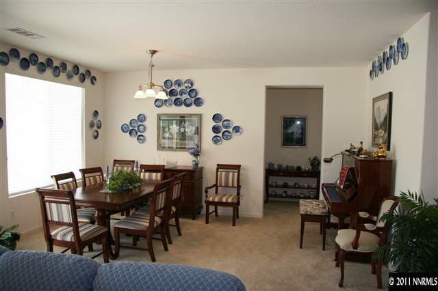 1335 Meridian Ranch Drive Reno, NV 89523 - Photo 4 of 7 a dining room with furniture a chandelier and window