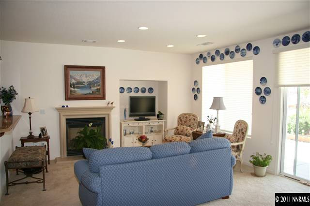1335 Meridian Ranch Drive Reno, NV 89523 - Photo 5 of 7 a living room with furniture a fireplace and a flat screen tv