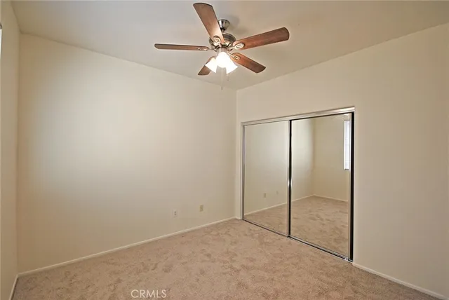 an empty room with fan
