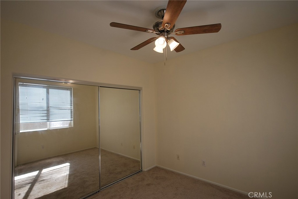 25209 Bishop Court Stevenson Ranch, CA 91381 - Photo 13 of 19 an empty room with windows and fan